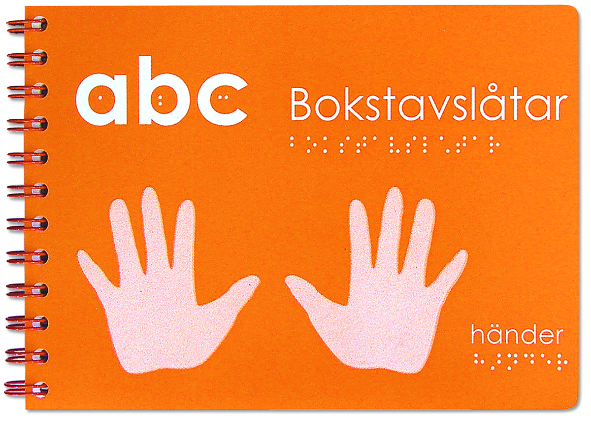 En orange ABC bok med en hand på framsidan.